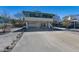 Stilt home featuring a large driveway and an enclosed lower level providing ample parking and storage space at 313 Magnolia Ave, Anna Maria, FL 34216