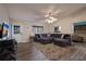 Comfortable living room boasts a spacious sectional, neutral tones, and a welcoming atmosphere for relaxing or entertaining guests at 313 Magnolia Ave, Anna Maria, FL 34216