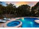 Pool and spa area with surrounding lounge chairs providing a relaxing experience at 313 Magnolia Ave, Anna Maria, FL 34216