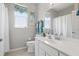 Well-lit bathroom with a large mirror, white vanity, and shower/tub creates a clean, serene space at 3218 45Th E Way, Bradenton, FL 34203