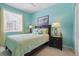Bright bedroom with a queen bed and coastal-themed decor creates a relaxing and inviting space at 3218 45Th E Way, Bradenton, FL 34203