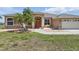 Charming single-story home featuring a manicured lawn and decorative stone accents and covered entry at 3218 45Th E Way, Bradenton, FL 34203
