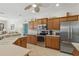 Efficient kitchen featuring stainless steel appliances, plenty of cabinet space, and tile flooring at 3218 45Th E Way, Bradenton, FL 34203