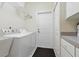 Clean and functional laundry room with modern washer/dryer units and ample storage space at 3218 45Th E Way, Bradenton, FL 34203