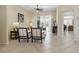Tiled living room featuring comfortable seating, ceiling fan, and a view of the outdoor living space at 3218 45Th E Way, Bradenton, FL 34203