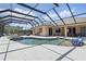 Expansive screened pool area with various seating options is ideal for outdoor relaxation and entertaining at 3218 45Th E Way, Bradenton, FL 34203