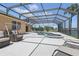 Extended screened patio and pool with ample seating areas for relaxing and enjoying the outdoors at 3218 45Th E Way, Bradenton, FL 34203