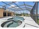 Luxurious screened-in pool with hot tub, patio, and scenic views for ultimate relaxation and entertainment at 3218 45Th E Way, Bradenton, FL 34203