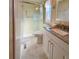 Updated bathroom features a granite countertop vanity with a walk-in shower and modern fixtures at 3232 Ash Ter, Sarasota, FL 34237