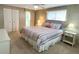 Bedroom featuring ceiling fan, windows, and neutral carpeting at 3232 Ash Ter, Sarasota, FL 34237