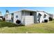 Charming home exterior featuring well-maintained landscaping, breeze way, and a screened-in porch at 3232 Ash Ter, Sarasota, FL 34237