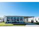 Charming single-story home featuring a screened-in porch and attached carport in a well-maintained community at 3232 Ash Ter, Sarasota, FL 34237