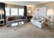 Bright and airy living room with large windows, comfortable seating, and stylish decor at 3232 Ash Ter, Sarasota, FL 34237