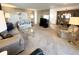 Inviting living room with neutral carpet, a large window, and comfortable seating at 3232 Ash Ter, Sarasota, FL 34237