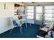 Inviting sunroom with casual seating and natural light through the numerous windows at 3232 Ash Ter, Sarasota, FL 34237