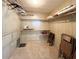 Spacious walk-in closet with multiple shelves and hanging rods provides ample storage, with folded chairs for convenience at 3232 Ash Ter, Sarasota, FL 34237