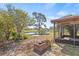 Picturesque backyard overlooking a pond, with a brick firepit at 3503 67Th W St, Bradenton, FL 34209