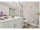 Bathroom with white vanity, toilet, and decorative accents creating a clean, functional space at 3503 67Th W St, Bradenton, FL 34209