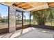 Relaxing screened porch with lattice details and scenic backyard view of pond at 3503 67Th W St, Bradenton, FL 34209