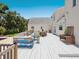 Spacious backyard with pool, multilevel deck with seating, dining, and mature landscaping at 3648 Beneva Oaks Blvd, Sarasota, FL 34238