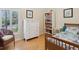 Comfortable bedroom featuring a woven chair, bright window, and bookcase at 3648 Beneva Oaks Blvd, Sarasota, FL 34238