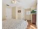 Comfortable bedroom with a ceiling fan, TV, tile floors, and ample closet space at 3648 Beneva Oaks Blvd, Sarasota, FL 34238