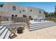 Spacious backyard deck with seating area, fire pit and grill overlooking the back yard at 3648 Beneva Oaks Blvd, Sarasota, FL 34238