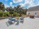 Relaxing outdoor deck with views of the sparkling pool and lush tropical landscaping at 3648 Beneva Oaks Blvd, Sarasota, FL 34238