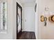 Inviting entryway with decorative glass, dark floors, and a charming coat rack at 3648 Beneva Oaks Blvd, Sarasota, FL 34238