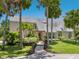 Attractive home featuring a manicured lawn, palm trees, walkway, and neutral colored siding at 3648 Beneva Oaks Blvd, Sarasota, FL 34238
