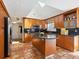 Spacious kitchen featuring custom wood cabinets, granite countertops, and stainless steel appliances at 3648 Beneva Oaks Blvd, Sarasota, FL 34238