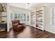 Comfortable living room area with hardwood floors, a bay window and a built-in bookcase at 3648 Beneva Oaks Blvd, Sarasota, FL 34238