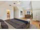 Bright main bedroom featuring wood floors, a large window, and access to the ensuite bathroom at 3648 Beneva Oaks Blvd, Sarasota, FL 34238
