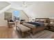 Serene main bedroom boasts vaulted ceilings, a large window, and comfortable seating area at 3648 Beneva Oaks Blvd, Sarasota, FL 34238