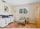 Cozy home office space with terracotta tile, shuttered window and corner furniture at 3648 Beneva Oaks Blvd, Sarasota, FL 34238