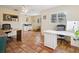 Bright home office space featuring terracotta tile flooring, large windows, and ceiling fan at 3648 Beneva Oaks Blvd, Sarasota, FL 34238