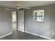 This bedroom features a neutral color palette, tile floors and a ceiling fan at 3826 Clover Ln, Sarasota, FL 34233