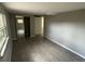 Spacious bedroom featuring fresh paint, modern wood-look flooring, and a mirrored closet at 3826 Clover Ln, Sarasota, FL 34233