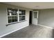 Enclosed sunroom with tile floors and large windows providing lots of natural light at 3826 Clover Ln, Sarasota, FL 34233