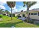 Serene backyard with a patio area perfect for relaxing outdoors, complemented by mature trees at 390 301 W Blvd # 13A, Bradenton, FL 34205