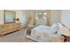 Bright bedroom with carpet, closet, and dresser featuring a relaxing atmosphere at 390 301 W Blvd # 13A, Bradenton, FL 34205