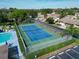 Community amenities with a pool, tennis court, and a beautiful outdoor area with lush green landscape at 390 301 W Blvd # 13A, Bradenton, FL 34205