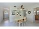 Cozy dining area featuring a decorative ceiling fan and a mirrored wall to expand the space at 390 301 W Blvd # 13A, Bradenton, FL 34205