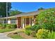 Charming single-story home featuring well-maintained landscaping and a welcoming front entrance at 390 301 W Blvd # 13A, Bradenton, FL 34205