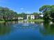 Scenic pond with fountain and well-maintained landscaping, perfect for enjoying waterfront views from the building at 390 301 W Blvd # 13A, Bradenton, FL 34205