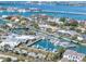 Panoramic aerial view of waterfront community with a marina, yacht club, and breathtaking views of bridges and city at 412 Pheasant Way, Sarasota, FL 34236
