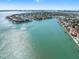 Bird Key aerial showcasing waterfront homes with boat docks and stunning blue water views from this desirable neighborhood at 412 Pheasant Way, Sarasota, FL 34236