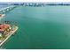 Waterfront home aerial showing panoramic water views and an expansive skyline, showcasing the beauty of the coastline at 412 Pheasant Way, Sarasota, FL 34236