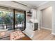 Kitchenette including beverage refrigerator, wine rack and sliding glass doors leading to an outdoor patio at 412 Pheasant Way, Sarasota, FL 34236
