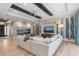 Open-concept living area with contemporary design, hardwood floors, and an abundance of natural light at 412 Pheasant Way, Sarasota, FL 34236
